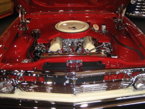 1998 Ford Crown Victoria - Close-up view of a polished engine bay with a V8 engine and custom air intake.