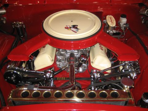 1998 Ford Crown Victoria - Engine bay details a prominent air cleaner and chrome accents on a V8 motor.