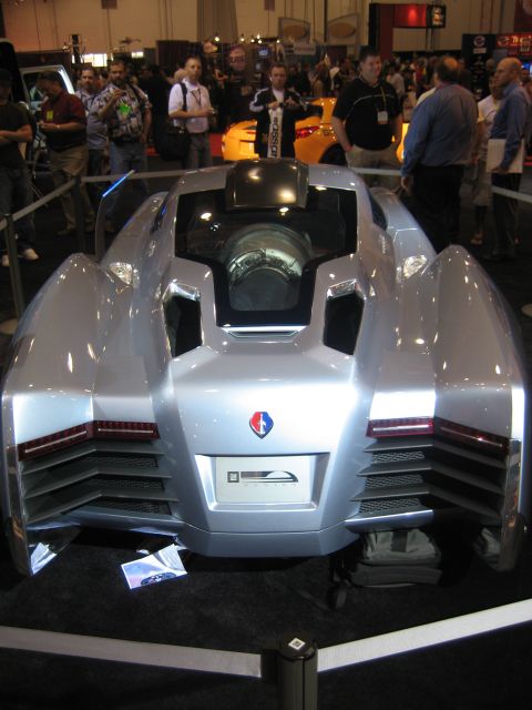1998 Ford Crown Victoria - This silver concept car has a unique rear design with exposed engine details visible through a glass panel.