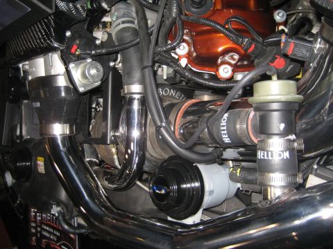 1998 Ford Crown Victoria - Close-up view of a modified engine bay a turbocharger and custom piping.