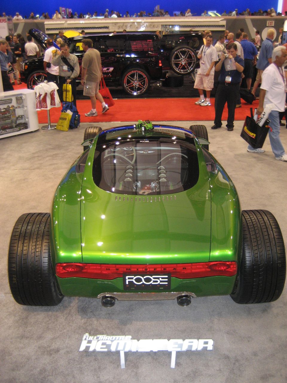 High rear view of green Foose Hemisfear roadster with big rear tires