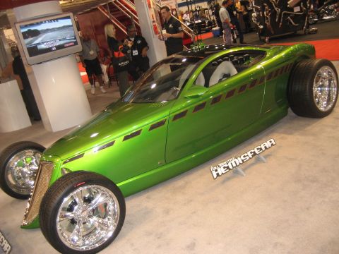 1998 Ford Crown Victoria - Custom hot rod with unique styling and large rear wheels on display.