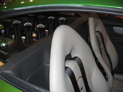 1998 Ford Crown Victoria - Interior view of a custom car, showing racing seats and chrome intake stacks.