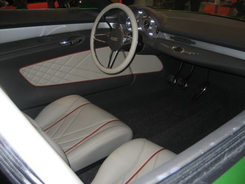 1998 Ford Crown Victoria - The custom interior features white diamond-stitched seats and a steering wheel bearing the 'ROOSE' emblem.