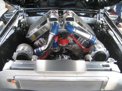 1998 Ford Crown Victoria - Custom twin turbo engine bay features polished aluminum intake piping and blue silicone hoses.
