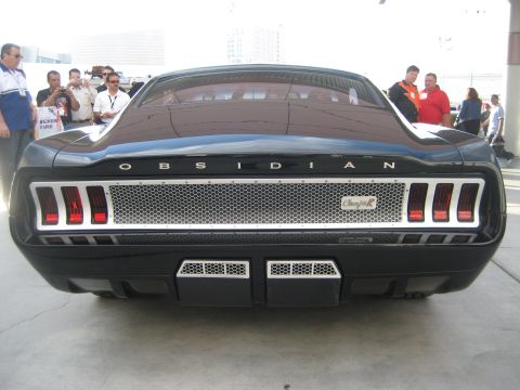 1998 Ford Crown Victoria - Rear view of a black car with custom taillights and 'OBSIDIAN' badging.