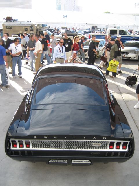 1998 Ford Crown Victoria - Black custom coupe with 'OBSIDIAN' badging and unique taillight design at an outdoor event.