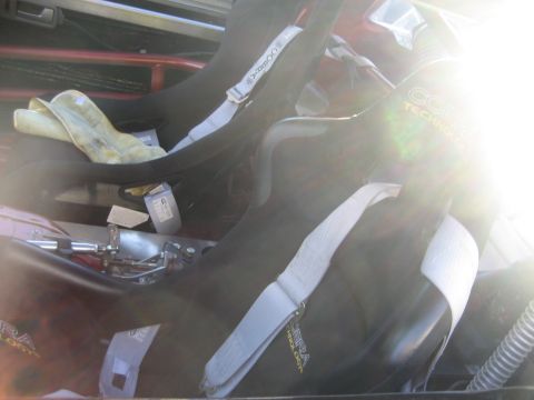 1998 Ford Crown Victoria - Interior view of racing seats with Cobra Technology branding and safety harnesses.