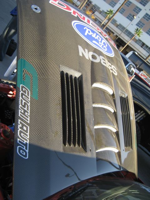 1998 Ford Crown Victoria - Custom carbon fiber hood a Ford logo and "NOBES" branding, with prominent vents.