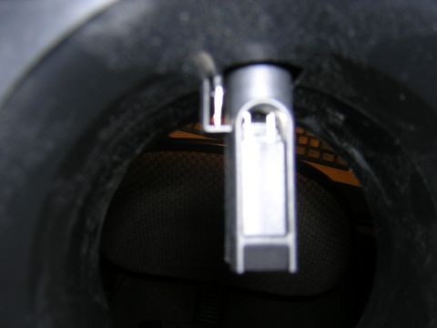 1979 Ford Bronco - A MAF sensor is visible within its housing, with a textured surface in the background.