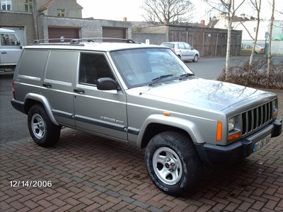 2000 Jeep Cherokee - This modified Jeep Cherokee features a panel van conversion, altering its original body style.