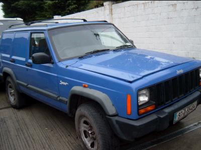 2000 Jeep Cherokee - This blue Jeep Cherokee van has a custom cargo area instead of rear seats.