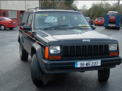 2000 Jeep Cherokee - Front view of a black Jeep Cherokee, license plate 96-WH-2217 is visible.