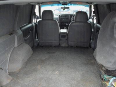 2000 Jeep Cherokee - The spacious cargo area of a 2000 Jeep Cherokee, viewed from the rear, showing the front seats and dashboard.