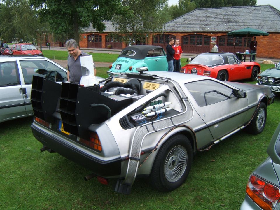 Silver DeLorean Back to the Future replica rear view at outdoor car show