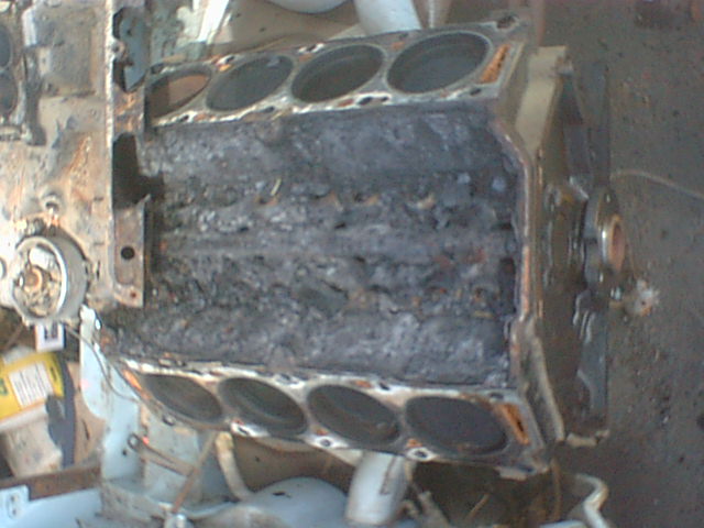 Disassembled V8 engine block with cylinders and crankcase exposed
