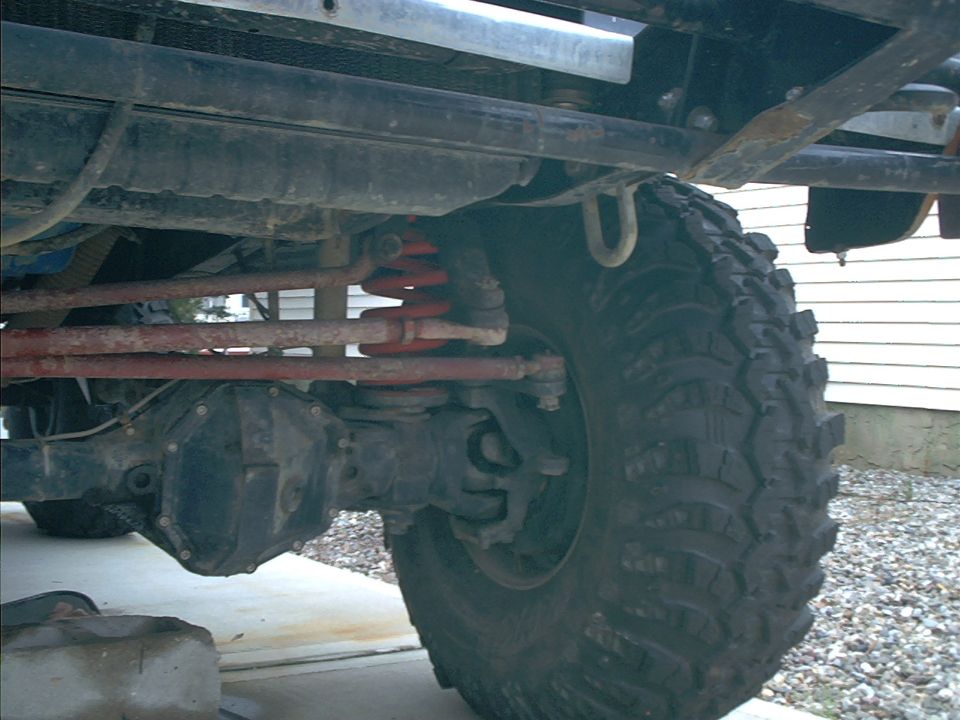 Close-up of the front suspension and tire of an off-road vehicle