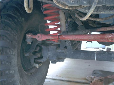 1978 Ford Bronco - Undercarriage view shows red suspension springs and steering components.