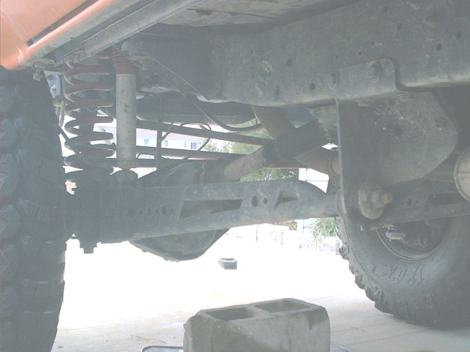 Undercarriage view showing suspension components and rear axle