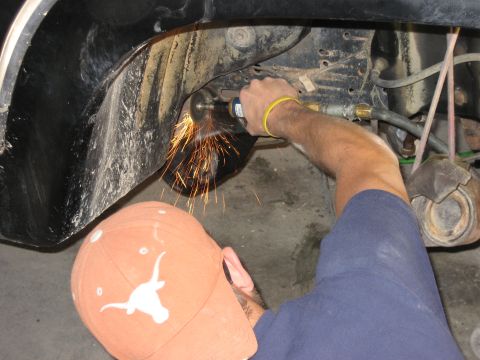 1986 Ford Bronco - grinding off the rivets holding the radius arm brackets on