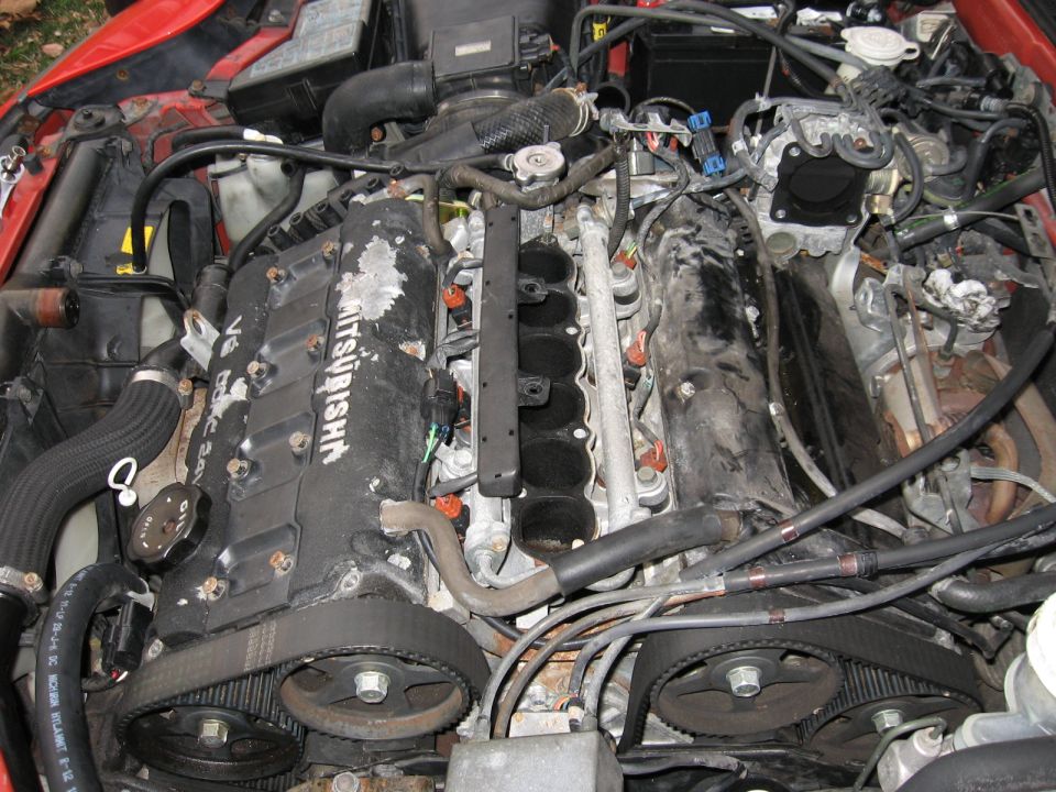 Mitsubishi V6 engine installed in a red car engine bay