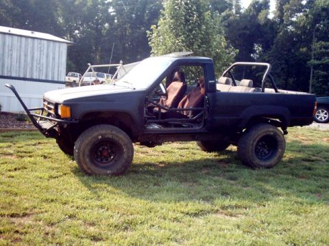 1988 Toyota 4Runner - This modified Toyota pickup truck features a roll cage and custom front bumper.