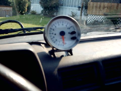 1988 Toyota 4Runner - A tachometer gauge is mounted on the dashboard of a vehicle.