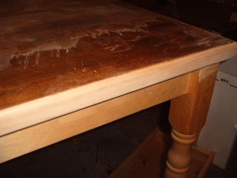 1988 Ford Bronco - Close-up of a wooden table's surface, revealing wear and tear.