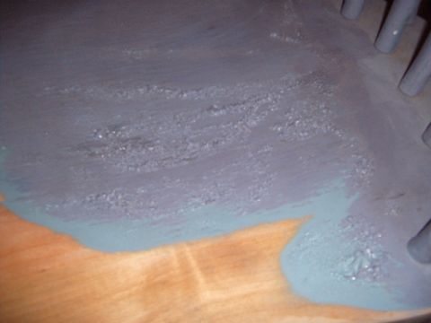 1988 Ford Bronco - A close-up view of a painted surface shows texture and color variations, with some cylindrical objects visible.