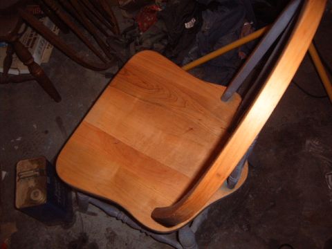 1988 Ford Bronco - A wooden chair with a metal frame is visible in this photograph.