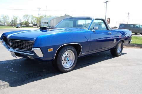 1970 Ford Ranchero - 1970 Ford Ranchero GT in blue with a hood scoop and aftermarket wheels.