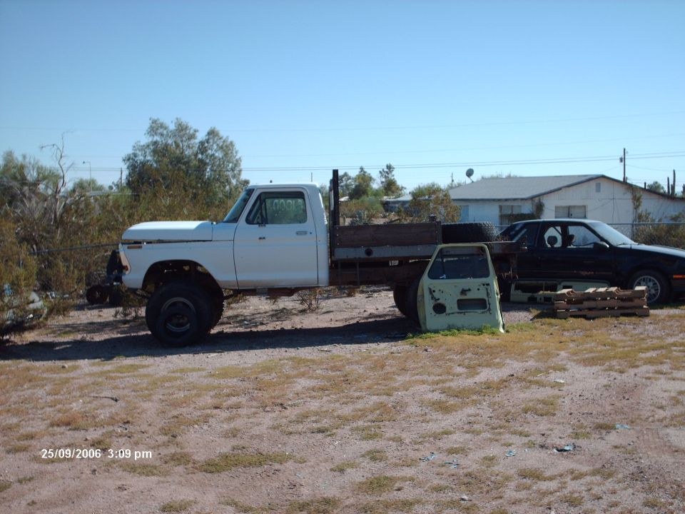 1977 Ford F-150 flatbed truck, side view, white
