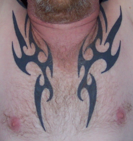 1979 Ford F-150 - Tribal flame tattoo covers the chest, with a Supermotors logo in the corner.