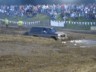 1989 GMC Jimmy - SUV struggling in a mud pit during an event.