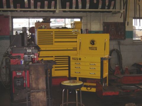 1992 Ford Bronco - A workshop scene large yellow tool chests and various automotive equipment.