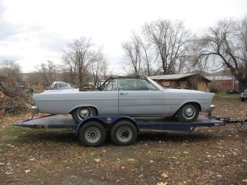 1964 Ford Galaxie - 1965 Ford Galaxie convertible on a trailer, primer gray finish. Convertible top is up.