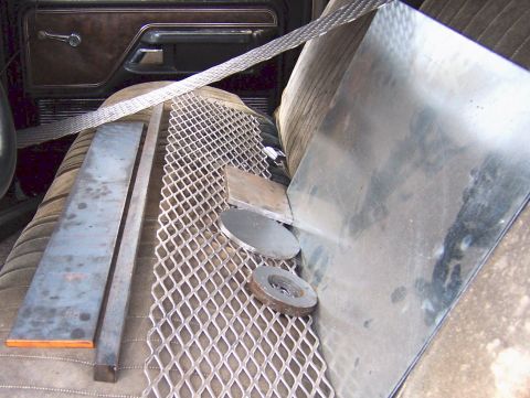 1978 Ford Bronco - Metal fabrication materials are stored inside the interior of a vehicle.