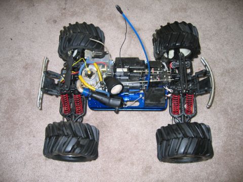 1987 Volkswagen Golf - This is a remote control monster truck, not a 1987 Volkswagen Golf. The image shows the chassis and engine components.