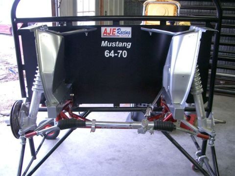 1965 Ford Mustang - Close-up of automotive suspension components, likely for a Ford Mustang from 1964-1970.