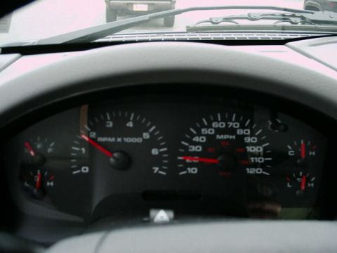 1997 Ford F-150 - Interior view of a vehicle's dashboard gauges, showing RPM, MPH, fuel, and temperature readings.