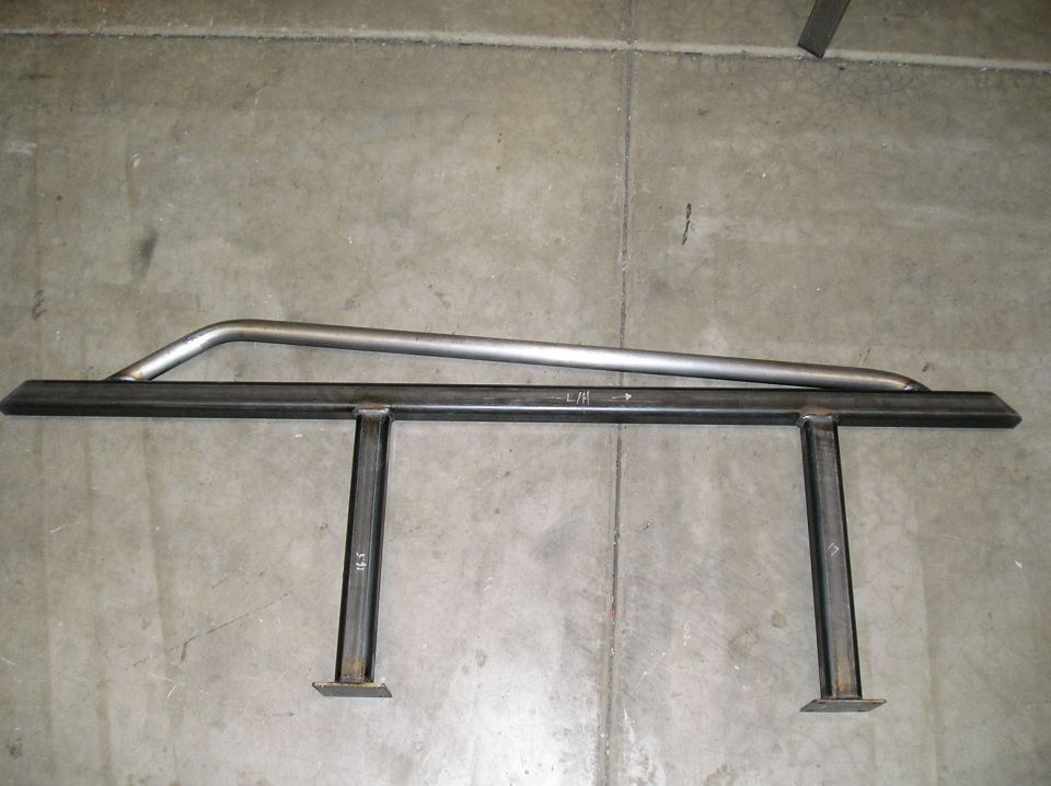 Bare steel fabricated rock slider marked L/H on shop floor