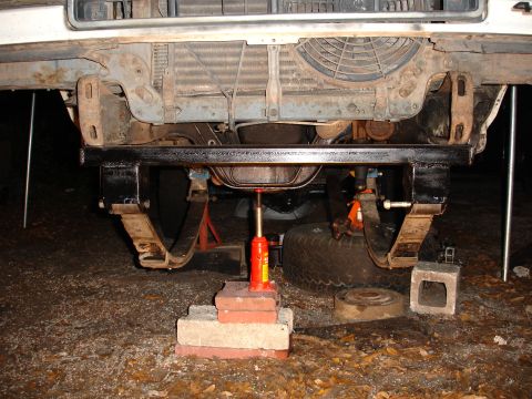 1989 Ford Bronco - The front underside of a vehicle, possibly from the 1980s, is shown with its suspension components exposed.