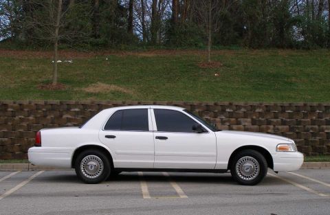 2001 Ford Crown Victoria - Side view of a white 2001 Ford Crown Victoria sedan.