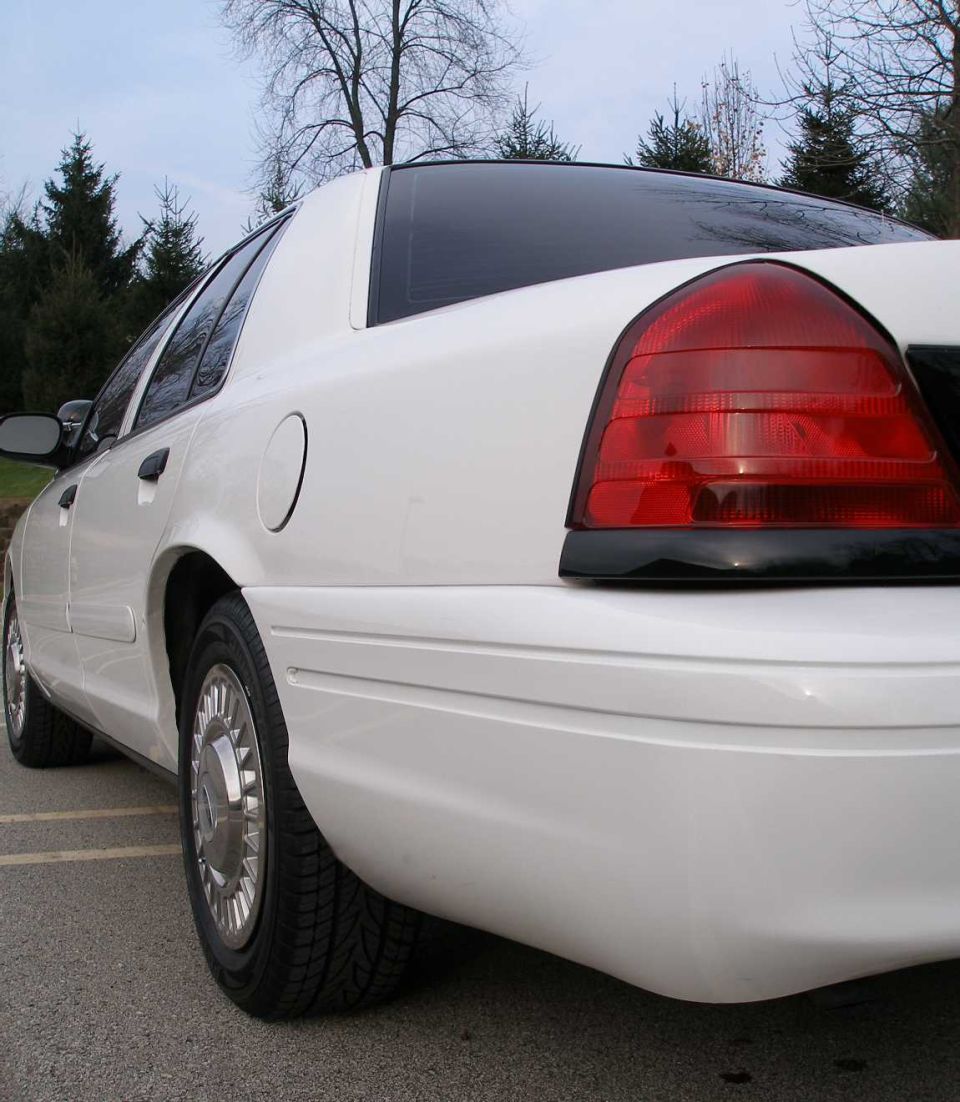 White 2001 Ford Crown Victoria rear quarter panel and taillight