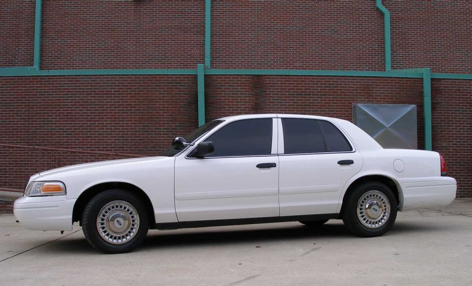 White 2001 Ford Crown Victoria sedan, side view
