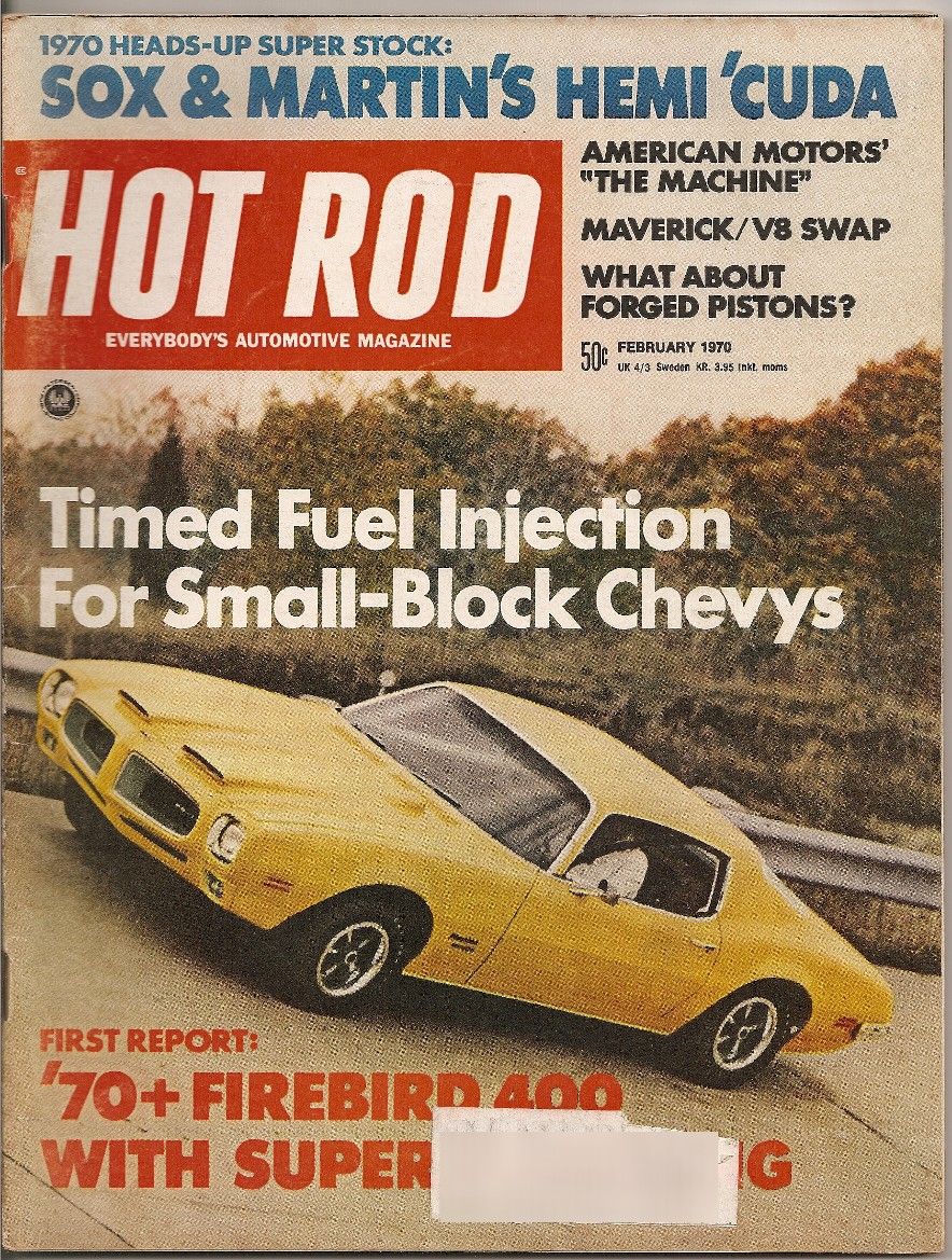 Yellow 1970 Firebird 400 with hood scoops and racing stripes, angled from the front-left