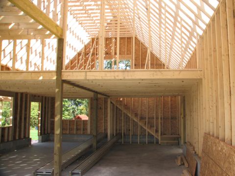 1992 Ford Bronco - Garage interior framing in progress, with visible wooden beams and wall studs.
