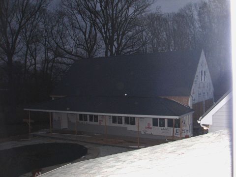 1992 Ford Bronco - A house is under construction, with visible framing and house wrap on the exterior walls.