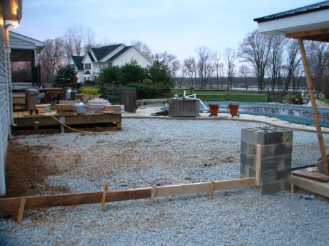 1992 Ford Bronco - Backyard under construction with a pool, deck, and houses in the background.