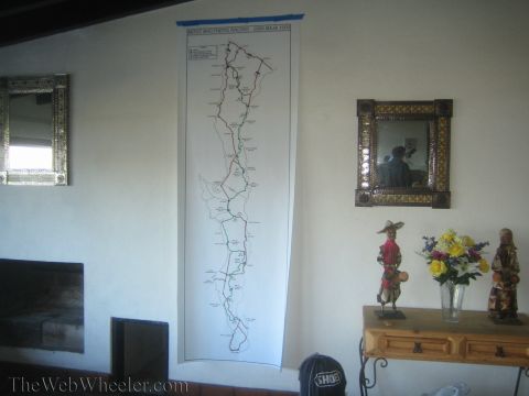 1990 Ford Bronco - Photo of a tall Baja 1000 race-course map poster taped to a wall in a decorated room.